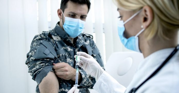 Wristbands and dining cards: New army policies exclude, isolate unvaccinated