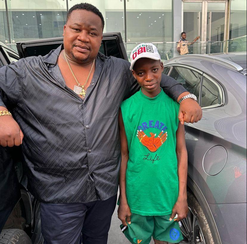 Cubana Chief Priest gifts boy who stood in front of Obi’s convoy scholarship