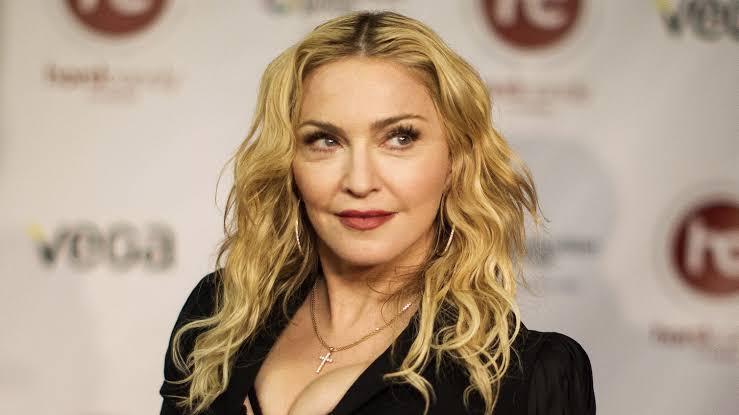 Madonna postpones tour after being admitted into intensive care