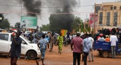 Mob beat politician on street after coup in Niger