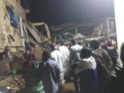 Scores trapped in collapsed building