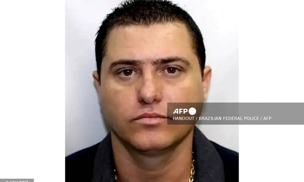 Wanted Brazil Militia Leader Surrenders To Police The leader of a notorious paramilitary group in Brazil wanted for a multitude of crimes, handed himself over to police on Sunday, the authorities said. The head of Rio de Janeiro state's biggest paramilitary group, Luis Antonio da Silva Braga, better known as Zinho, had been on the run since 2018 and is the subject of at least a dozen outstanding warrants, according to a police statement issued late Sunday. "Zinho" has been designated the state's "public enemy Number 1." He handed himself over to the Federal Police in southeast Rio on Sunday and was arrested, said the statement. Justice Minister Flavio Dino hailed the arrest on X Monday as a victory "in the fight against criminal groups." Militia groups sprung up some four decades ago from the ranks of former police, soldiers, firefighters, and prison guards as community self-defense units against the threat posed by drug gangs in the city known for its picturesque beaches but also its violent crime. Initially well-meaning, they later started extorting "protection" money from businesses and took control of service provision to inhabitants of Rio's poor favelas. They have in recent years expanded into drug trafficking and money laundering. The militias control more than half of Rio's territory, imposing a reign of terror in poor neighborhoods home to more than two million people, according to a 2020 study by a consortium of universities, online watchdog platforms and a government anti-crime hotline. In October, the killing by police of a nephew and lieutenant of Zinho saw militia members torch 35 buses and a train drivers' cabin in Rio. The same month, the militias were blamed for the murders of three doctors visiting Rio for a conference after one was apparently mistaken for the leader of a rival group.
