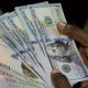 Naira puts strong dollar in check, settles at N1255/$