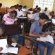 Students writing examinations