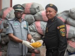 Western Marine Customs Area Controller, Comptroller Paul Bamisaiye handing over the 4,973 loaves of cannabis sativa weighing 2.433kg to Commander Narcotic, Mr Morrison Udo in Lagos on Wednesday.
