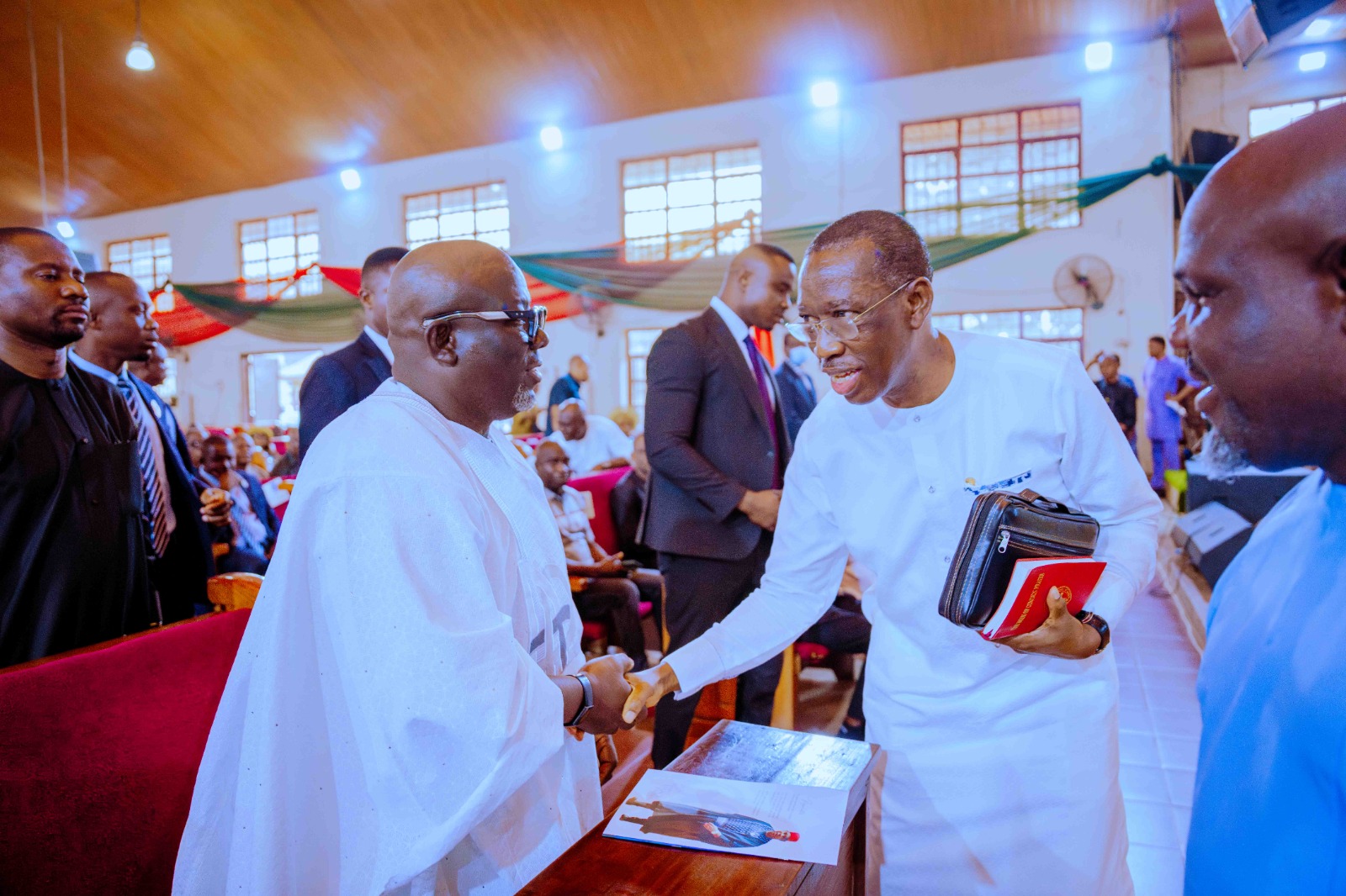 Governor Sheriff Oborevwori in a warm hand shake with his predecessor, Dr Ifeanyi Okowa