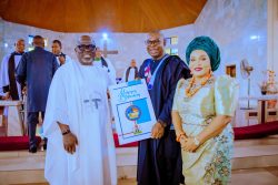 Governor Sheriff Oborevwori presenting a birthday card to his Deputy, Sir Monday Onyeme. at his 60th birthday