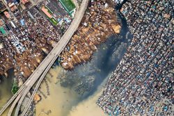 Nigeria Makoko stilt houses against Victoria Island skyline