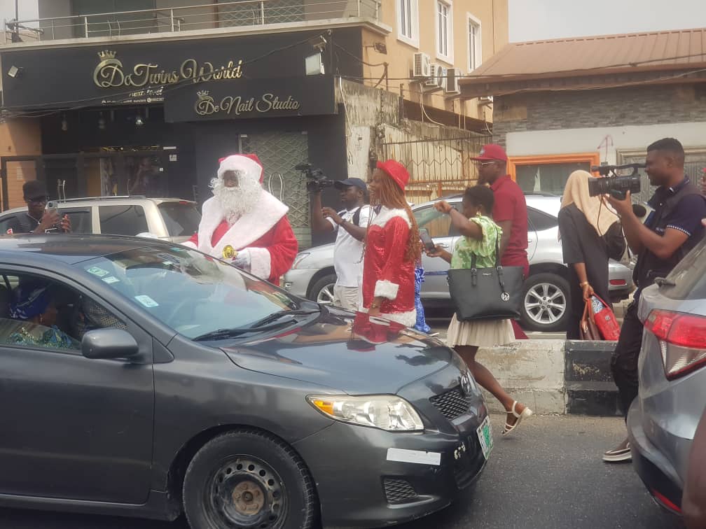 Yuletide: Desmond Elliott in santa costumes preaches love doles gifts to constituents
