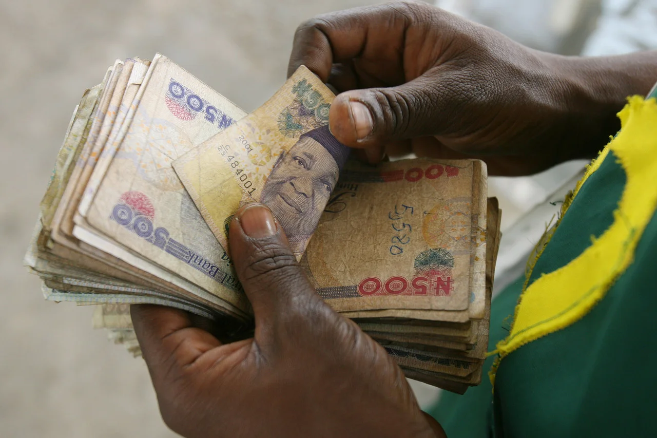 Naira edges lower amid moderate volatility as analysts forecast stability in 2026