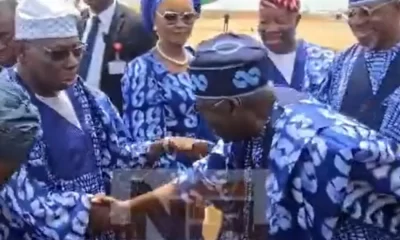 Tinubu’s bow to Obasanjo at Ogun Airport commissioning sparks nationwide praise