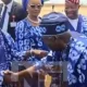 Tinubu’s bow to Obasanjo at Ogun Airport commissioning sparks nationwide praise