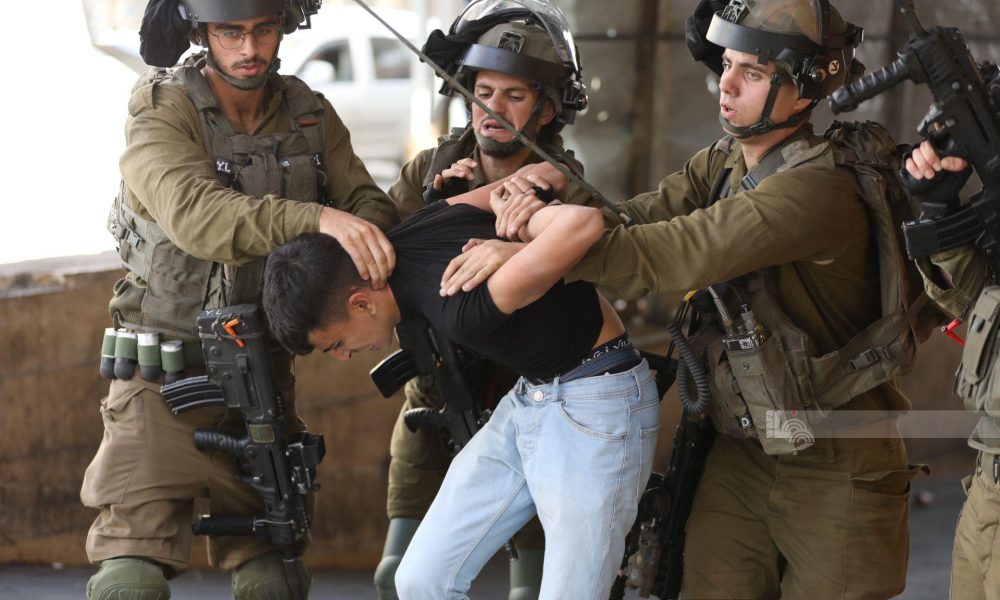 Israeli Forces arrest over eight Palestinians found in secret truck compartment {Watch video}