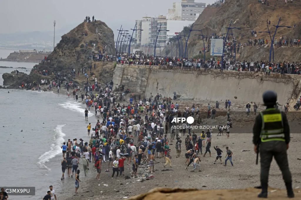 At least 18 migrants die as thousands enter Spanish enclave of Ceuta amid border crisis