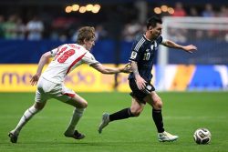 Messi magic sinks England, sends Argentina into World Cup final